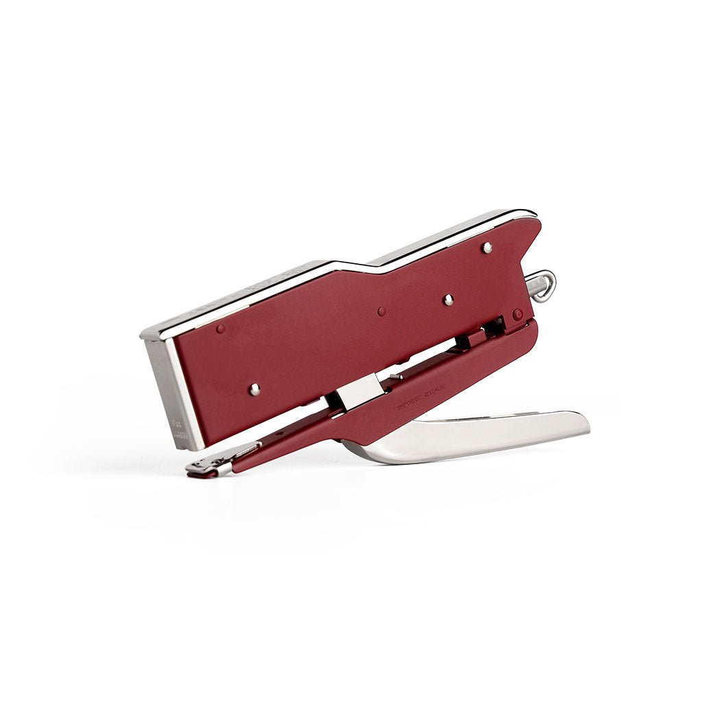 Handheld Zenith 548 stapler with burgundy red body and a silver metal handle