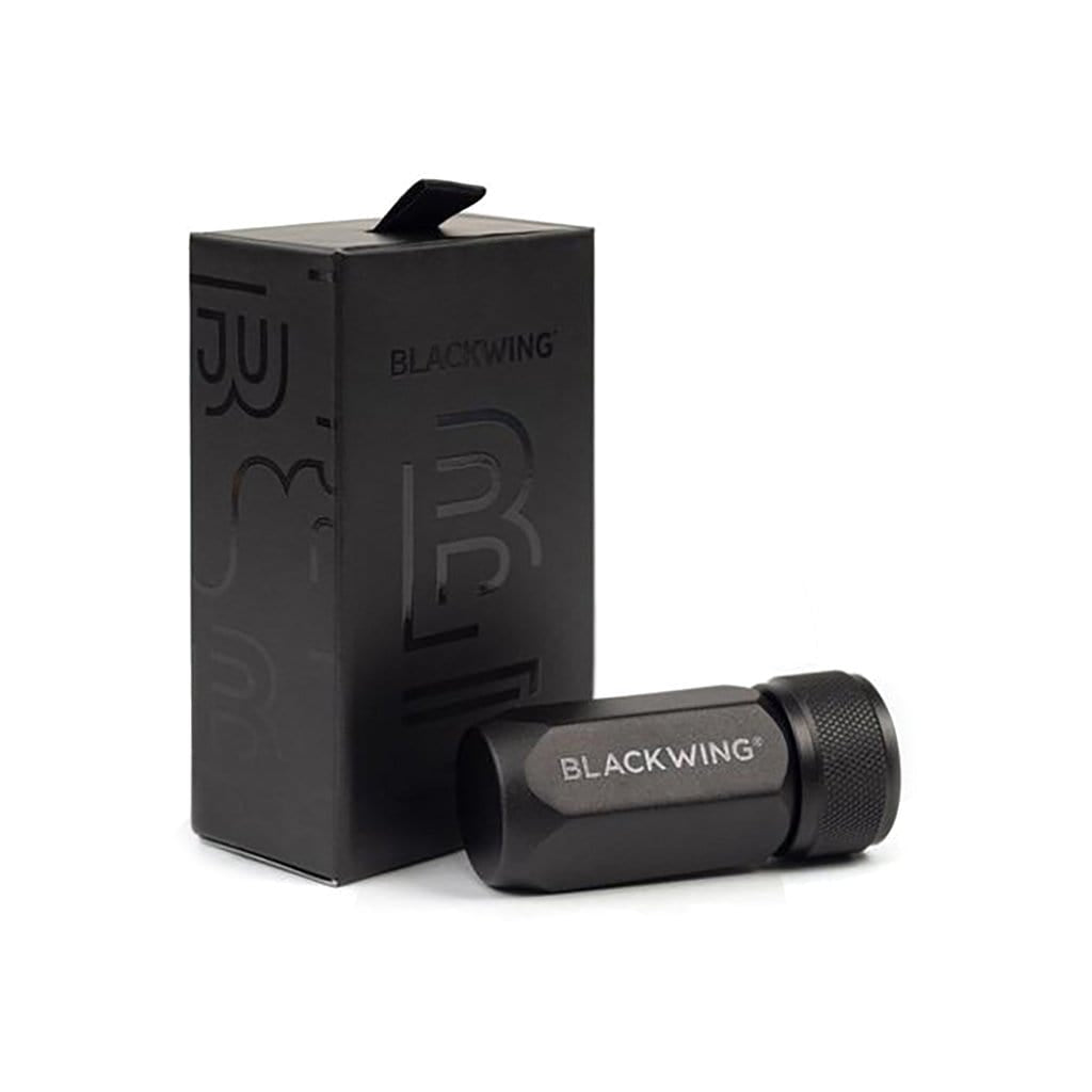 Black pencil sharpener with Blackwing branding and packaging on white background