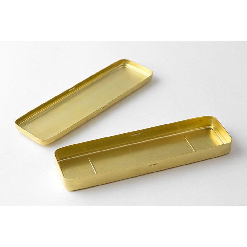 Open Brass pen case and lid on white background