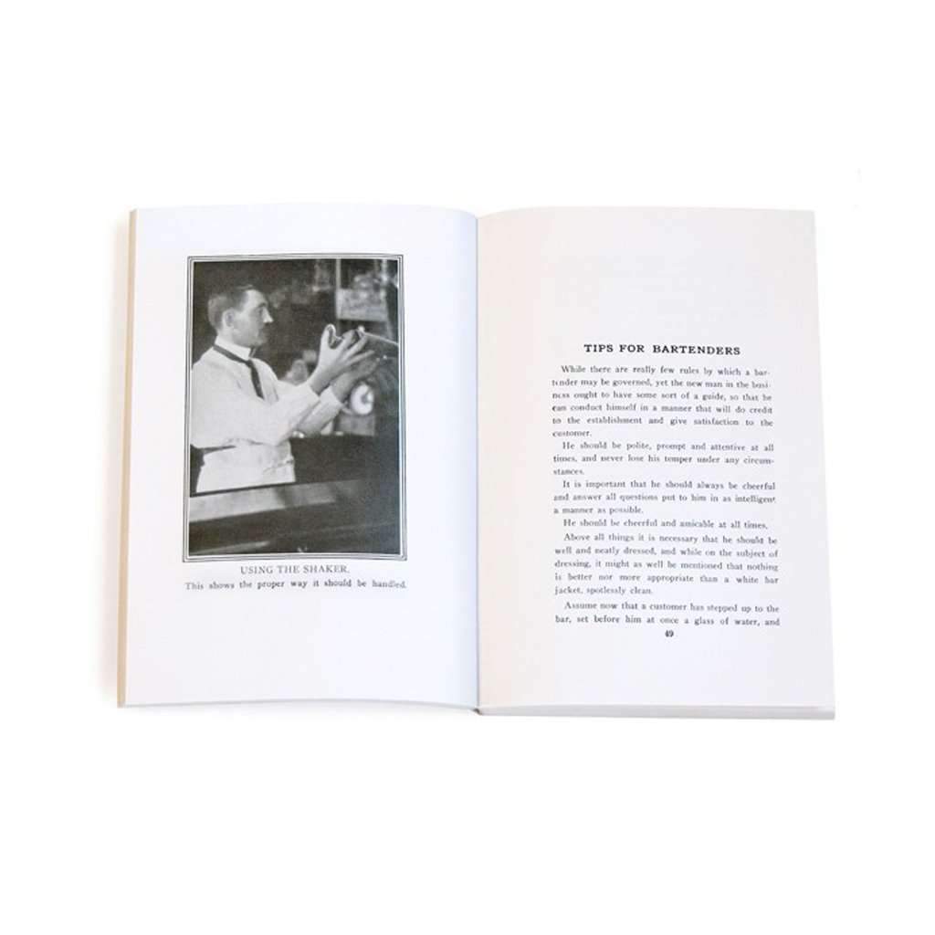 Open book with a black and white photo of a bartender on the left page and text on the right page.