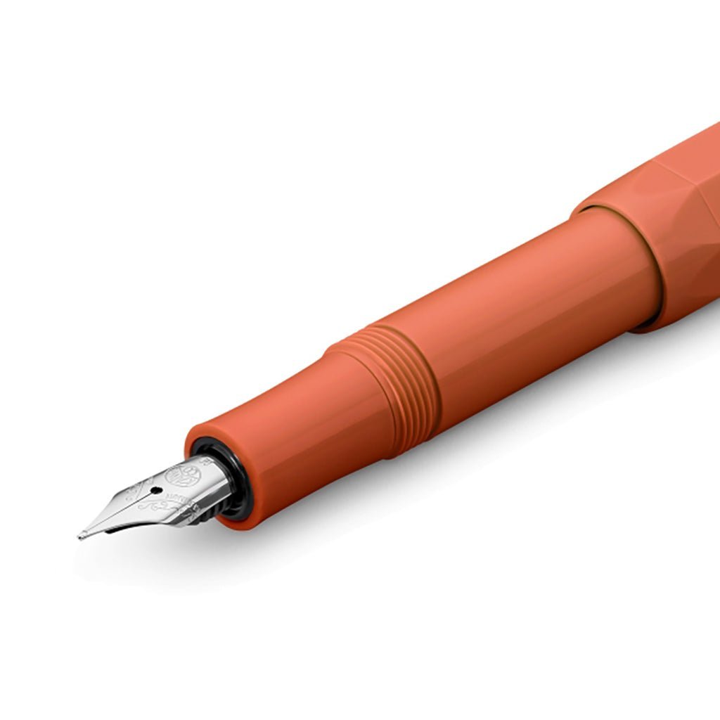 Orange fountain pen on a white background