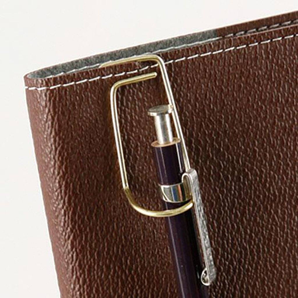 Brown leather wallet with a pen holder attached on a white background