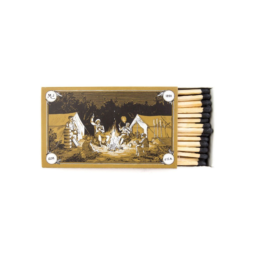 Matchbox with illustration of a camp scene on a white background