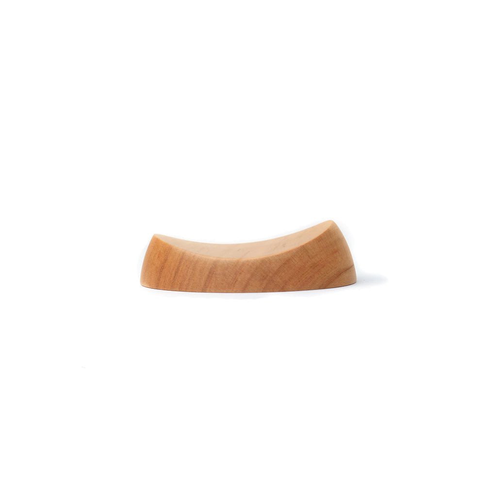 Wooden pen rest with curve on white background