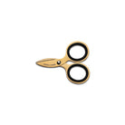 Small gold steel scissors on white background 