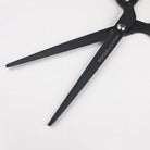Matte black scissors open on white background