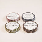 Four rolls of 'classiky's' adhesive washi tape on a white background