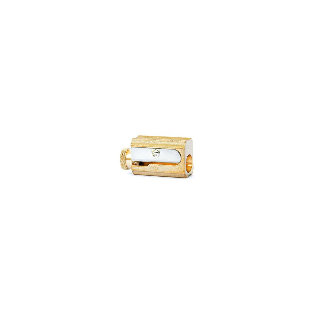Brass sharpener with adjustable knob on white background