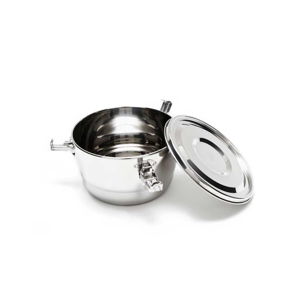 Stainless steel container open with lid on white background