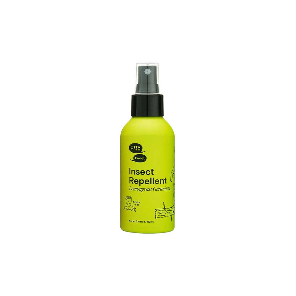 Yellow insect repellent spray bottle on a white background