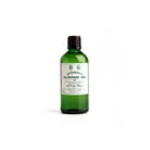 Green bottle of almond oil by D. R. Harris on white background