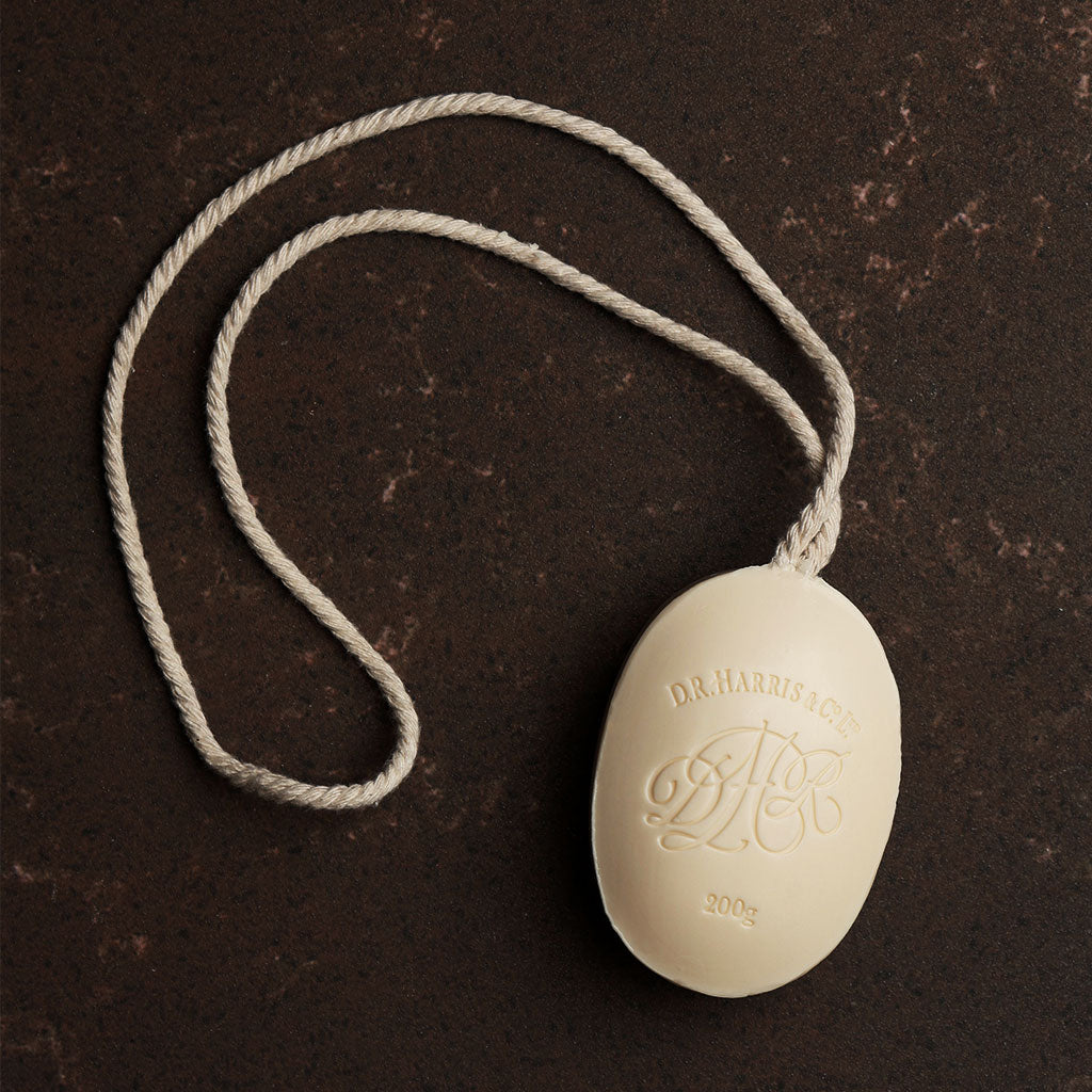 D. R. Harris soap on a rope on a dark brown background