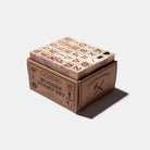 Wooden stamp set with alphabet stamps in a box on a white background