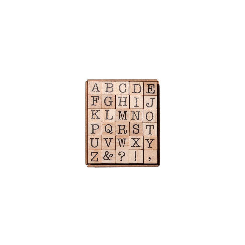 Set of 30 wooden stamps with uppercase letters and symbols in packaging on white background