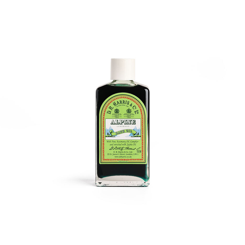 Bottle of D.R. Harris & Co. Alpine bath oil on a white background