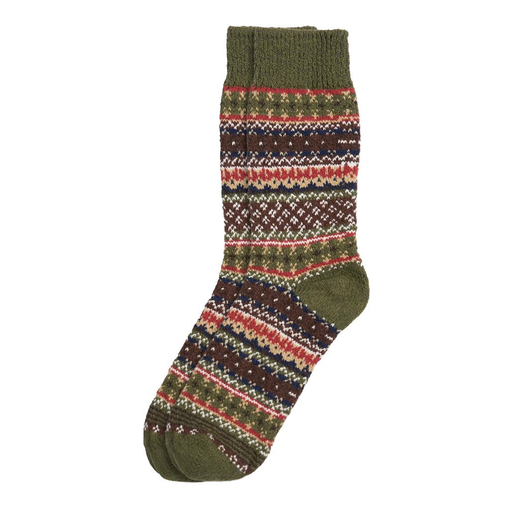 A colorful cotton sock in a fair isle pattern in shades of olive green, brown, and red.