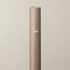 Close-up of a kraft paper tube of incense sticks.