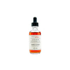 Bottle of Jack Rudy Cocktail Co. bitters on a white background