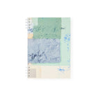 Notebook with abstract multicolored design on a white background