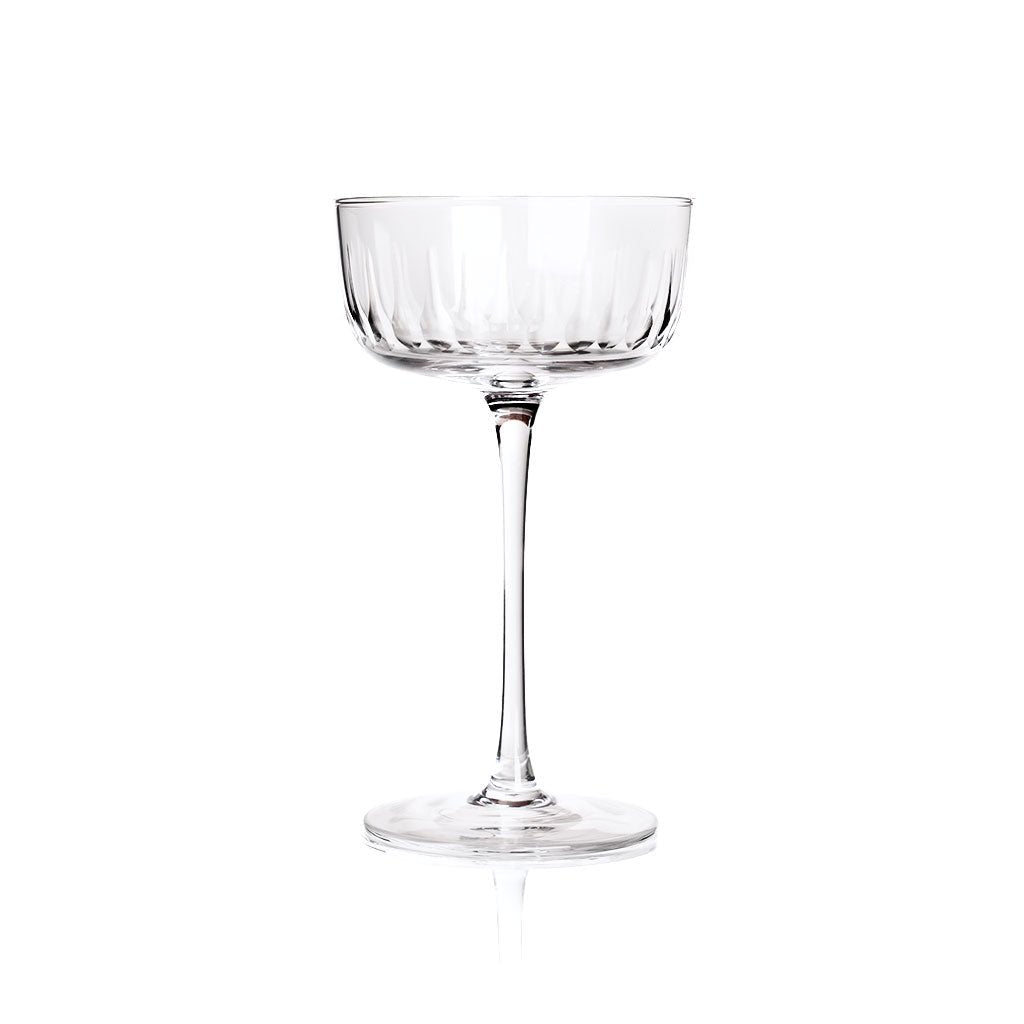 Clear glass coupe on a white background
