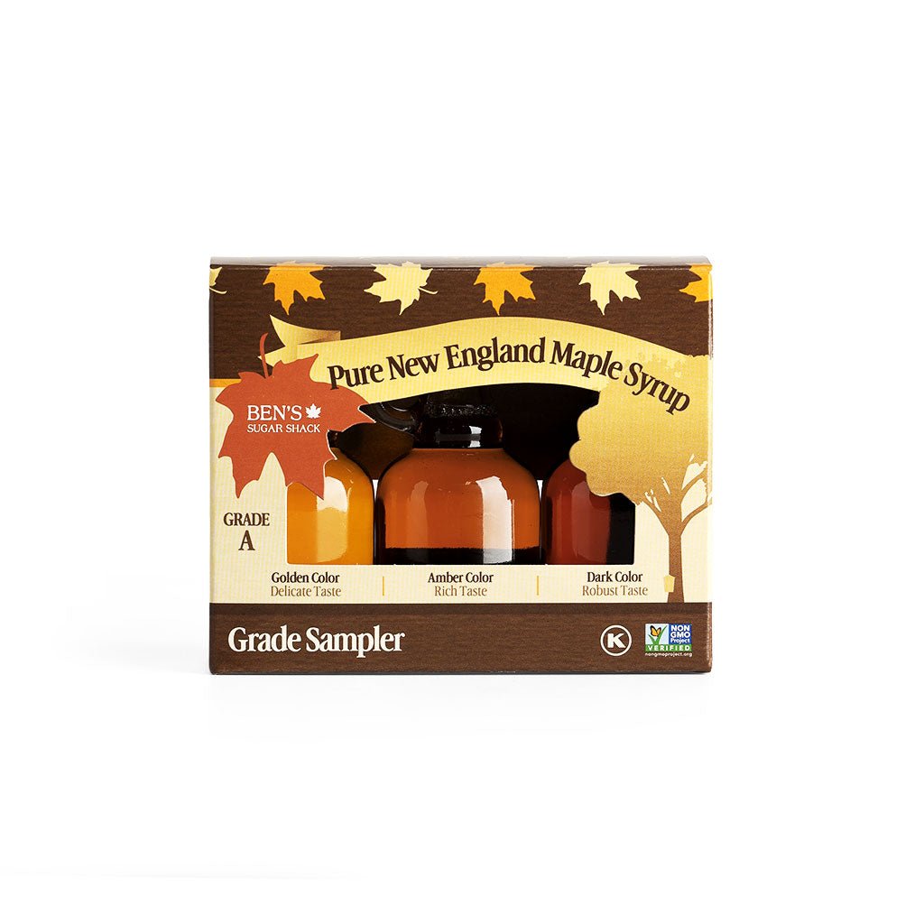 New England Maple Syrup sampler box with three bottles of golden, amber, and dark syrup.