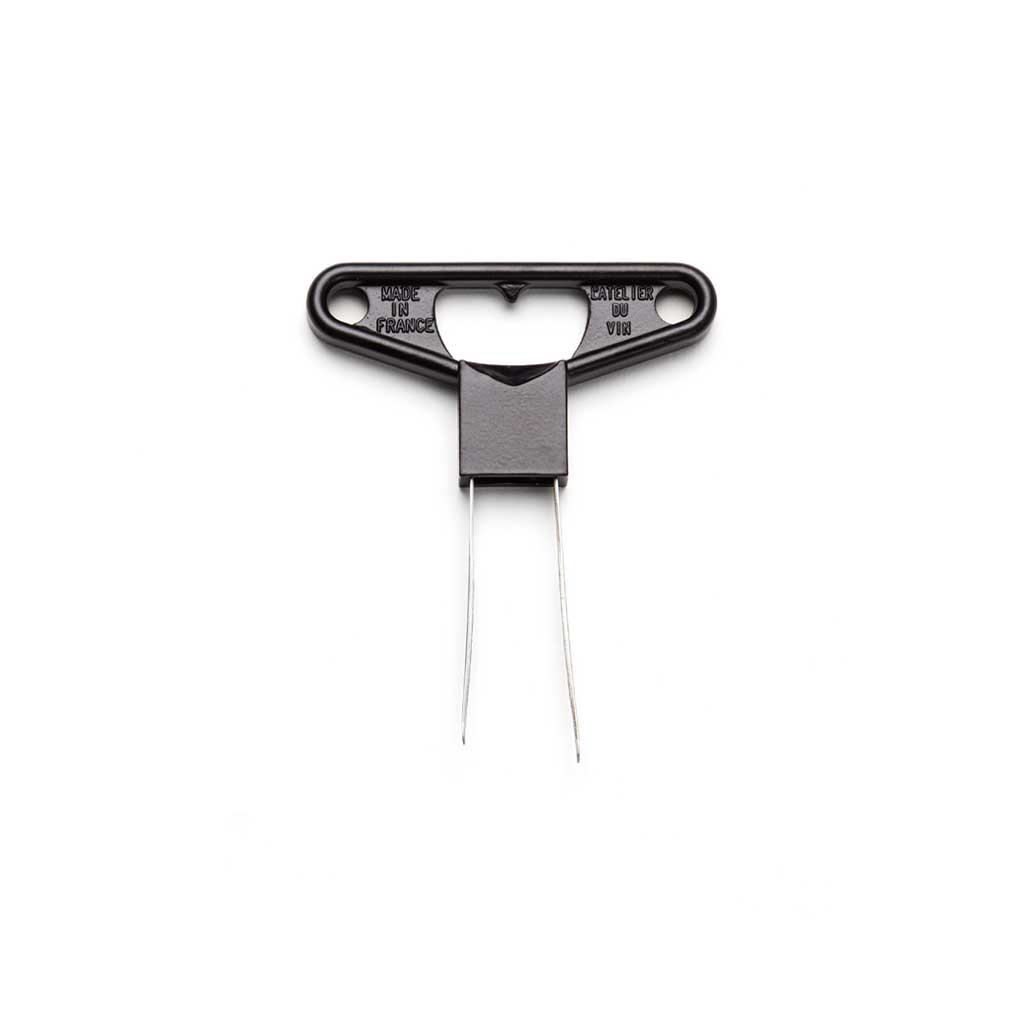 Silver cork extractor with a black handle on a white background