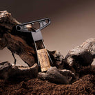 Black cork extractor with a cork on a rustic wooden background