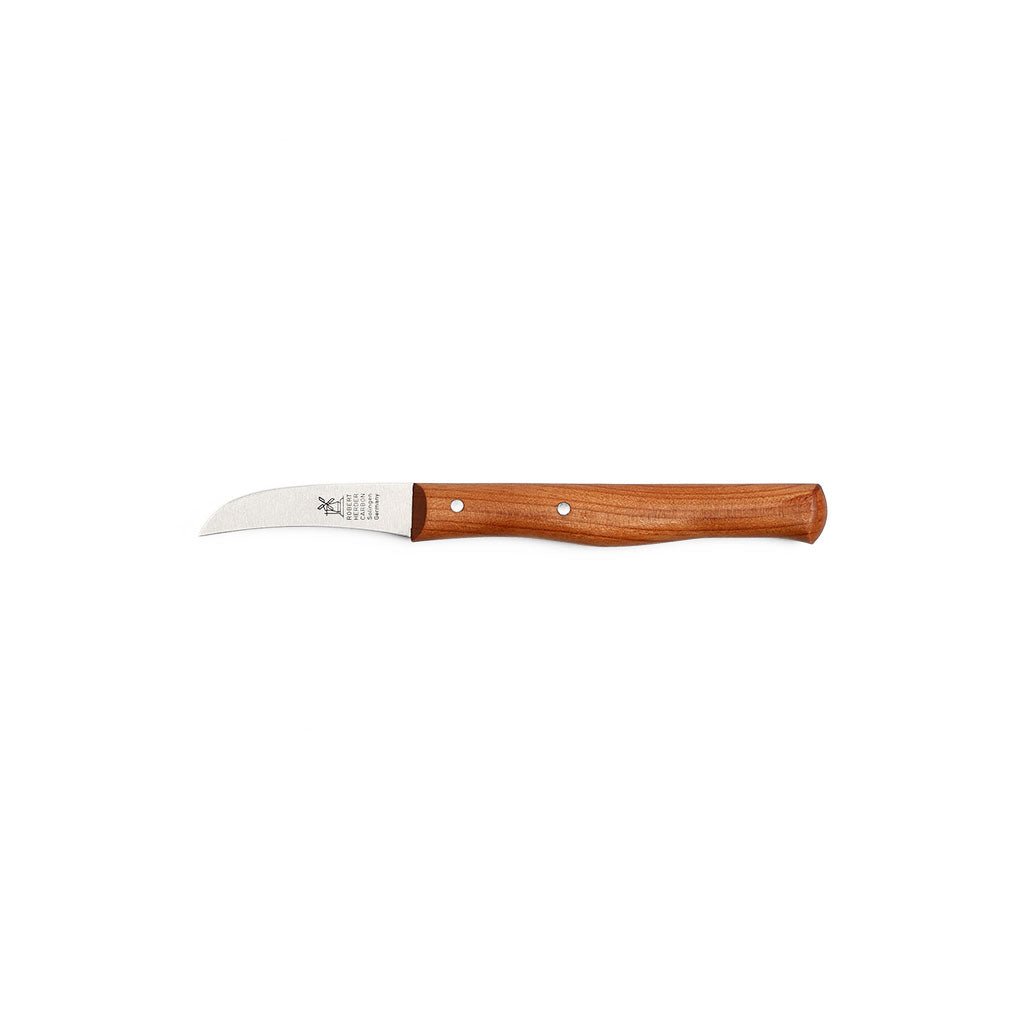 Curved carbon steel paring knife with cherrywood handle on white background