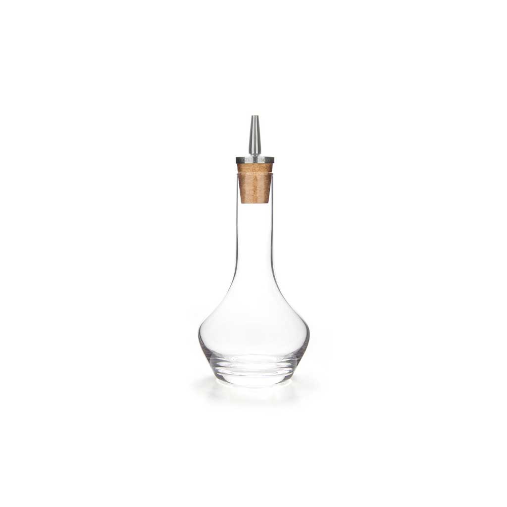 Clear glass bitters bottle with cork and stainless steel top dasher on white background