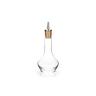 Clear glass bitters bottle with cork and stainless steel top dasher on white background