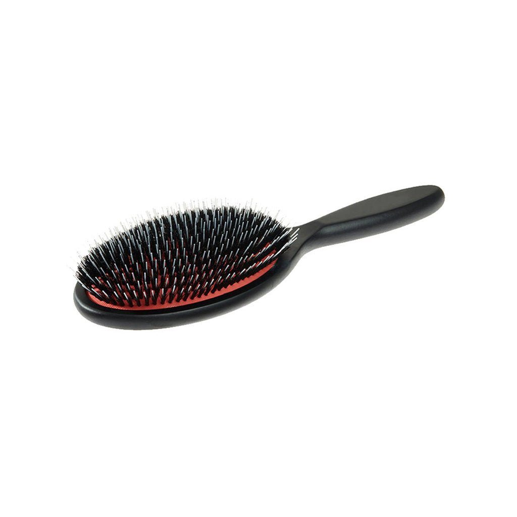 Black beech wood cushion hairbrush with boar and nylon bristles on white background