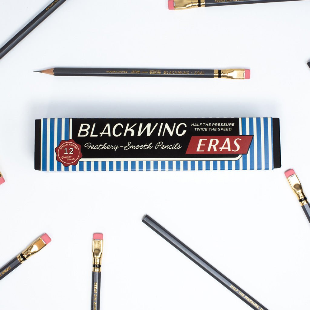 A box of Blackwing Eras pencils next to loose pencils.