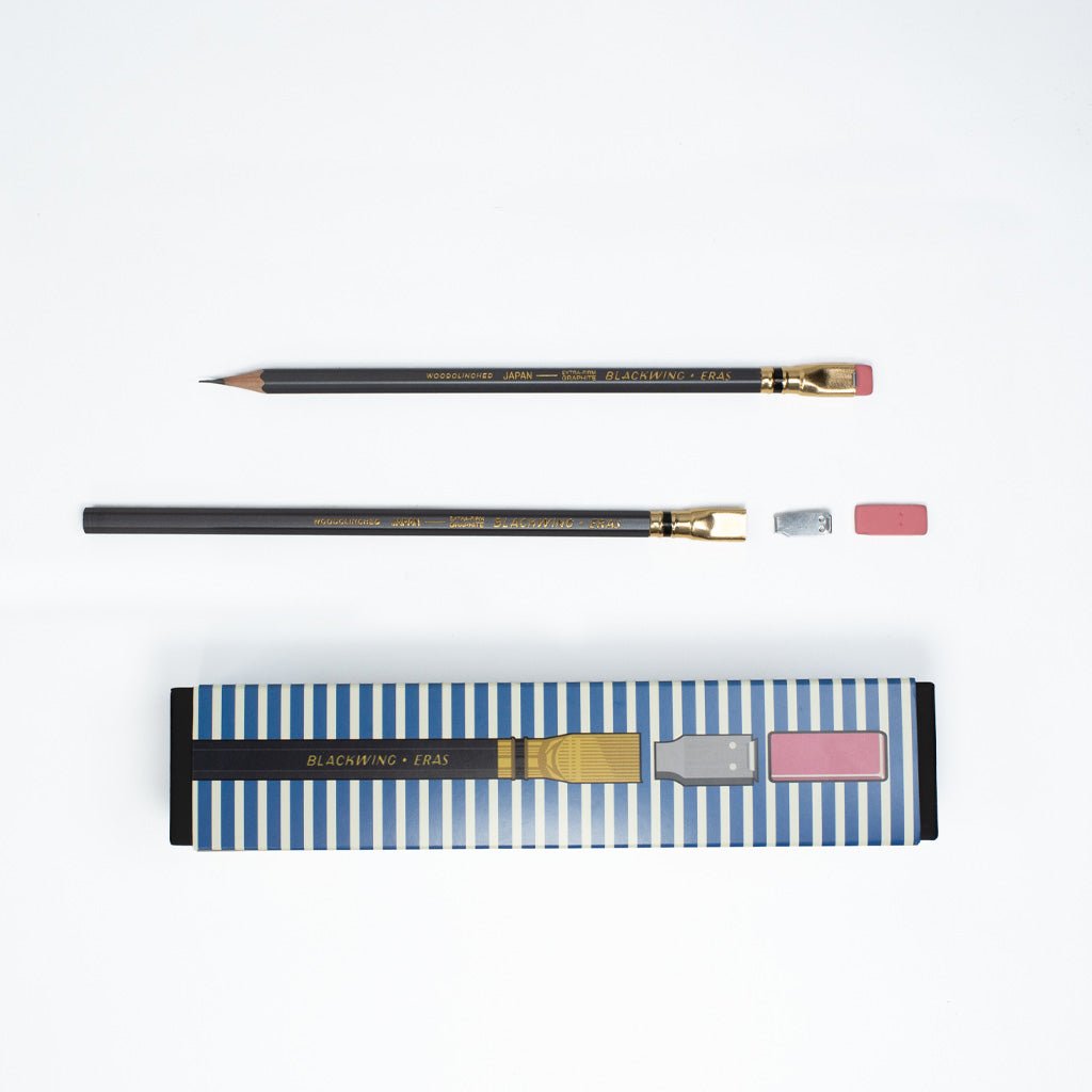 Box of pencils next to pencil with eraser and ferrule taken apart.