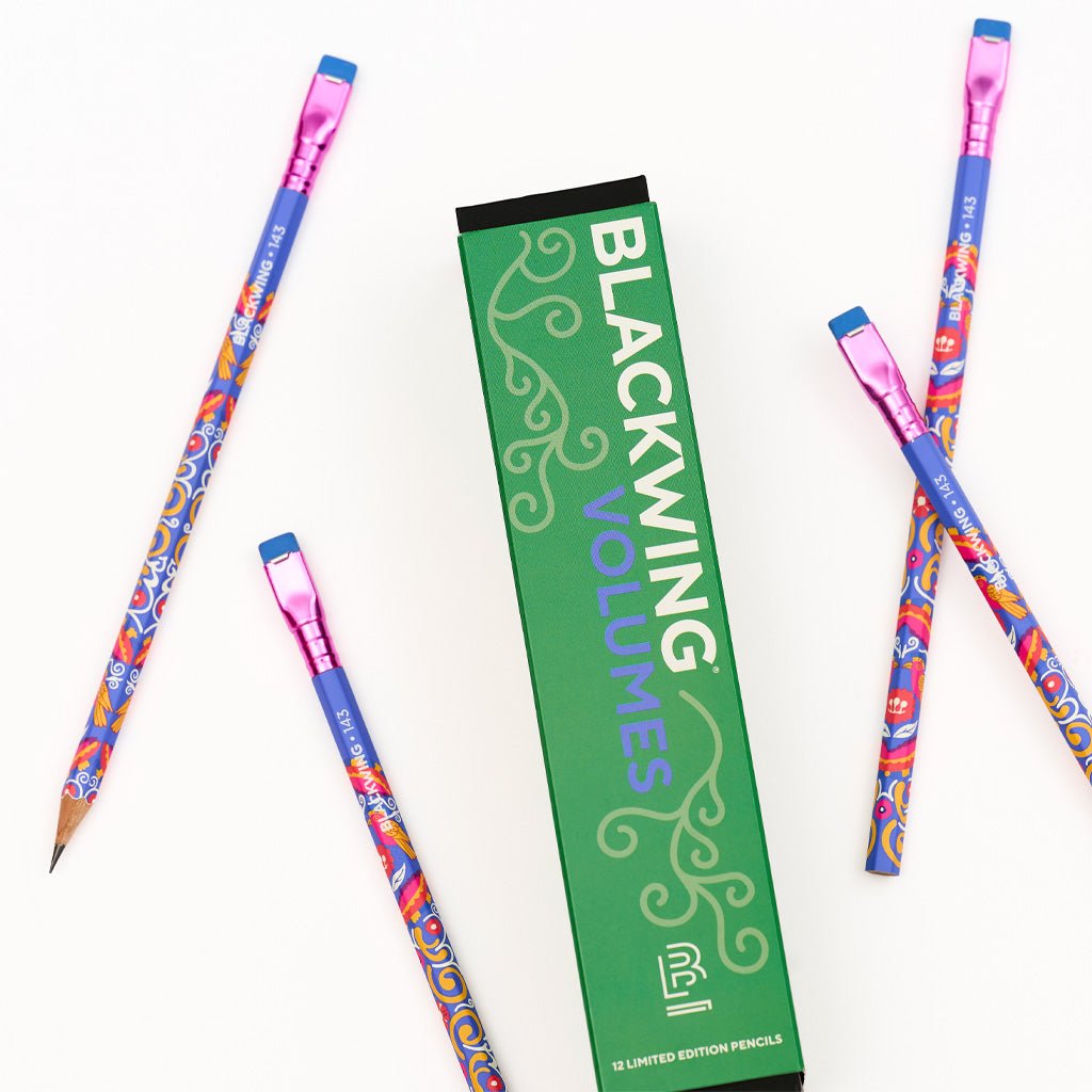 Box of Blackwing pencils next to loose pencils.