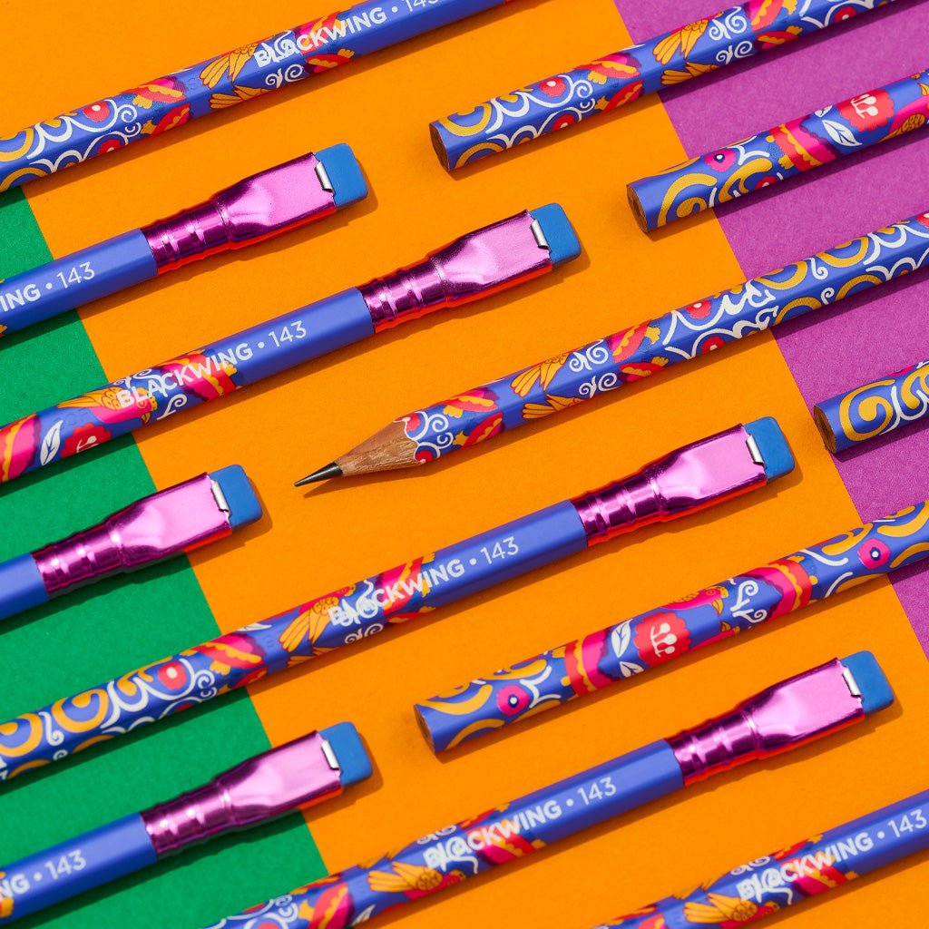 Volume 143 Blackwing pencils on colorful background.