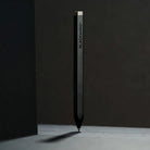 Black aluminum pen with 'BLACKWING' branding on a dark background