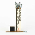 A box of Blackwing Volumes 21 pencils on a white background. The box is open and the pencils can be seen. 
