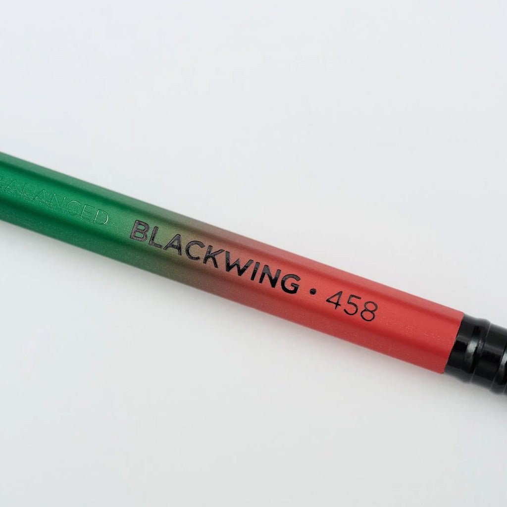Close up of Blackwing 458 pencil with gradient design on light background