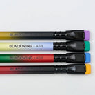 Close up of four Blackwing 458 pencils with gradient design on light background