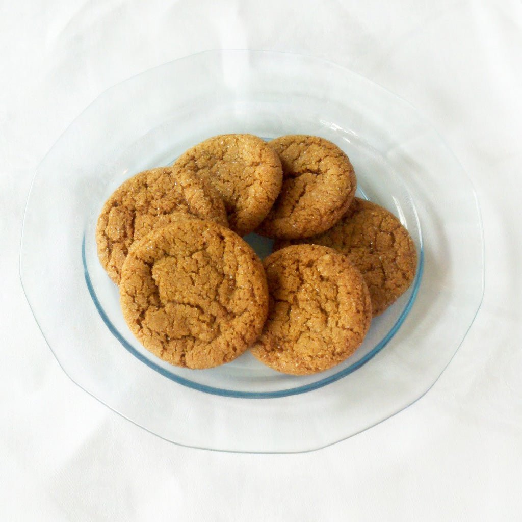 Glass plate of ginger snap cookies.