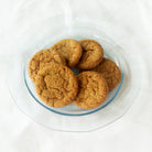 Glass plate of ginger snap cookies.