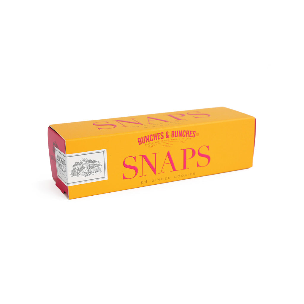 Box of ginger snap cookies on white background.
