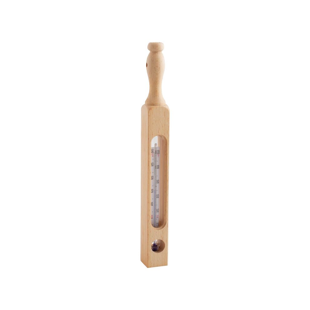 A wooden bath thermometer with a clear glass tube showing temperature markings, set against a plain white background.