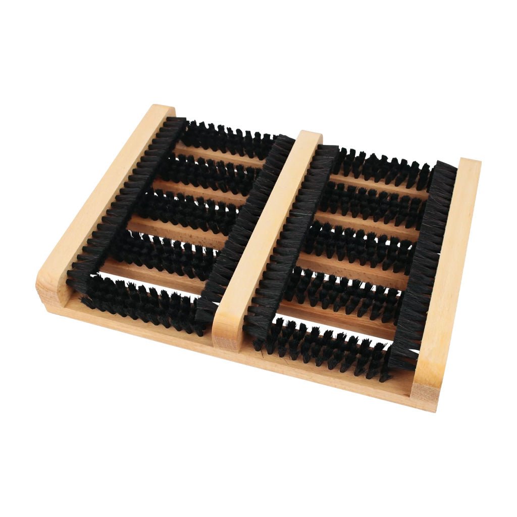 Wooden shoe scraper with rows of black horsehair bristles on white background