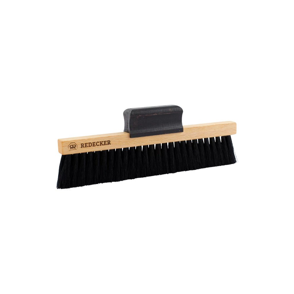 A Redecker brand phonograph brush with black bristles, a light wood handle, and a black plastic handle attachment, shown on a plain white background.