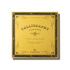 A yellow square calligraphy guide sheet book on white background