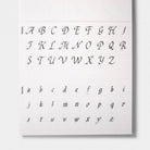 A calligraphy guide sheet with uppercase and lowercase letters and guide lines on light background