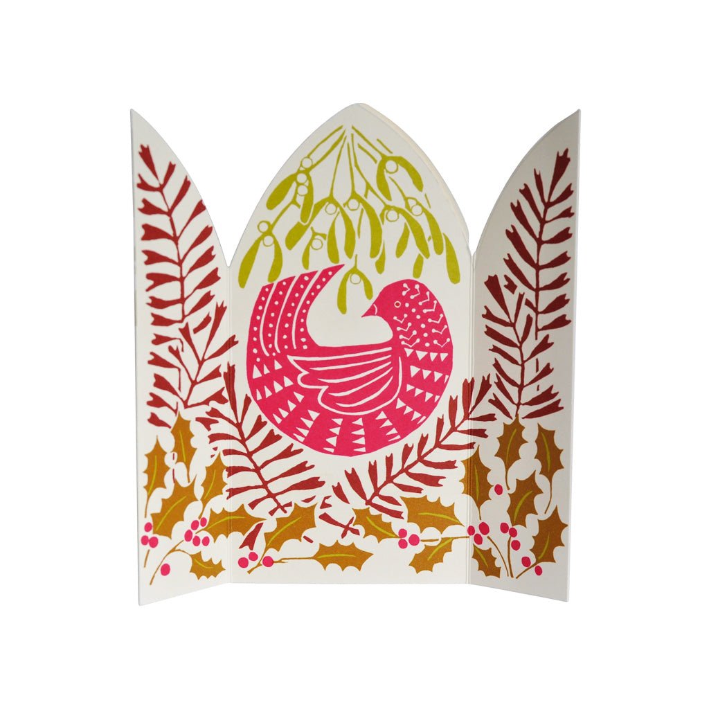 An unfolded festive paper greeting card featuring a stylized bird in pink and red, surrounded by mistletoe, holly leaves, and berries on a white background.