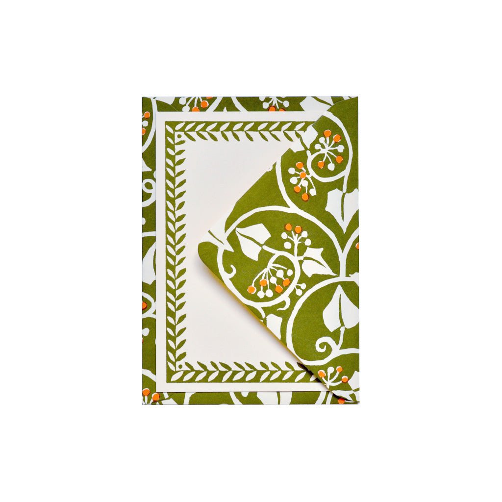 Cambridge Imprint Notecard on top of decorative envelope with a green and white botanical border pattern.