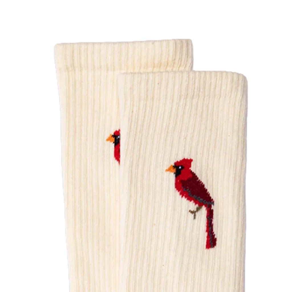 A pair of off-white ribbed crew socks featuring embroidered red cardinal birds on the sides, displayed against a solid white background.